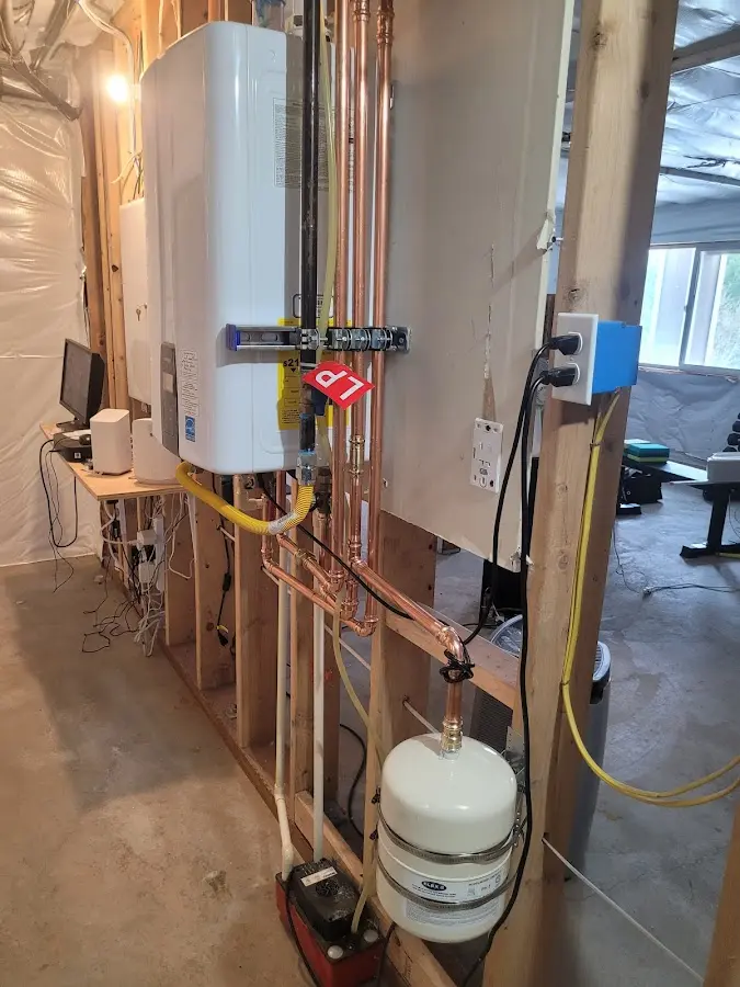 Licensed plumber repairing a kitchen sink in Meredith